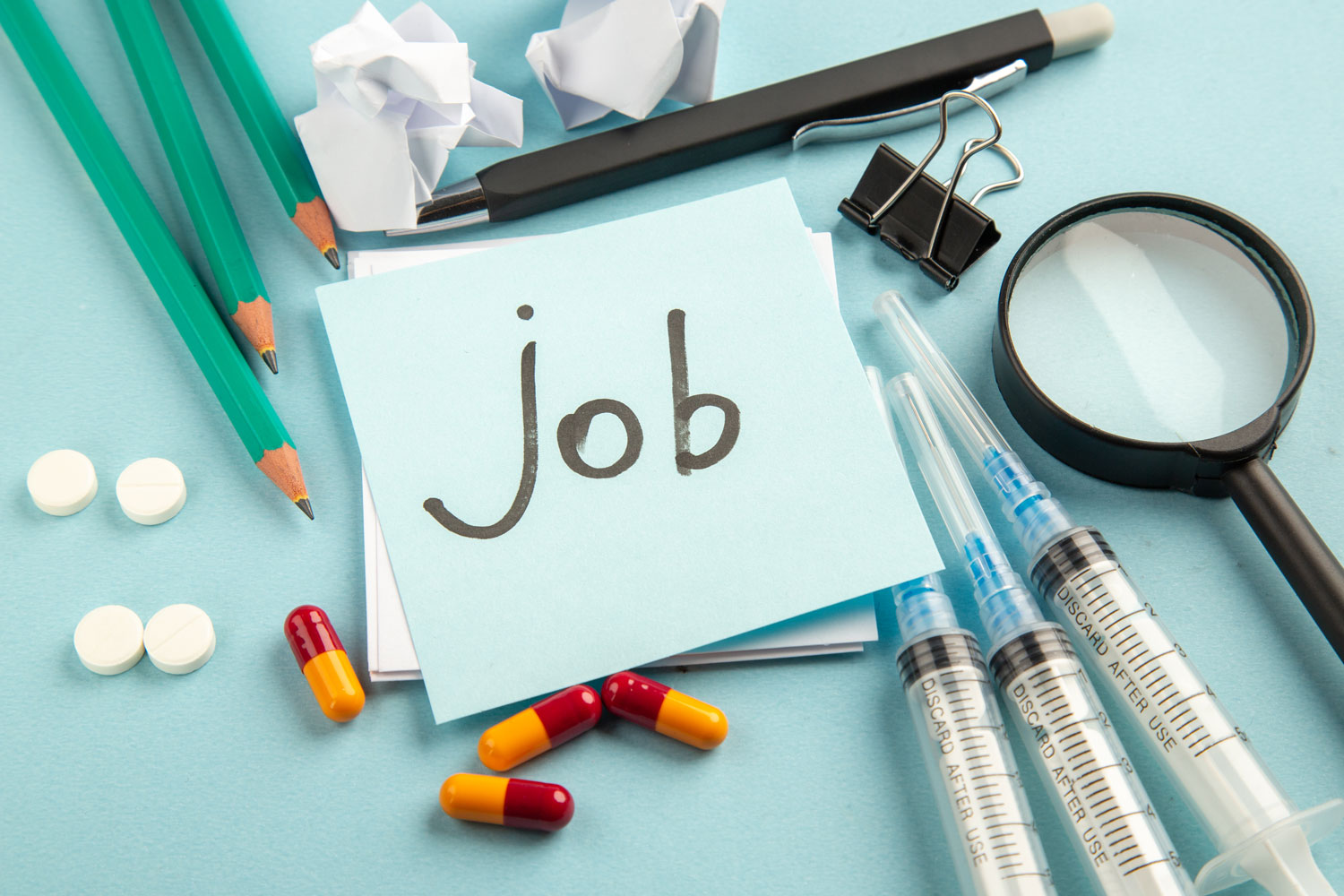 Job note with pills and injections for pharmacy job search